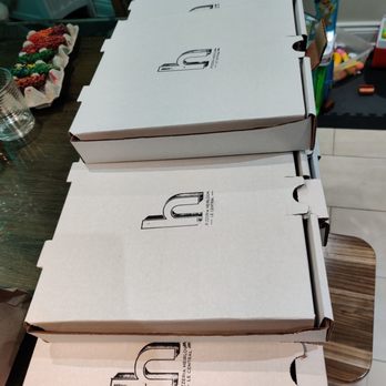Heirloom - a stack of pizza boxes - Pizza Near Me - Montreal, Quebec