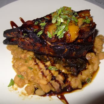 Chef's Table At the Edgewater - House smoked pork chop & crispy pork belly with white bean cassoulet & candied collards, habanero-peach chutney - New American Near Me - Winter Garden, Florida