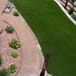 Removal of grass, leveled backyard and installed turf.
