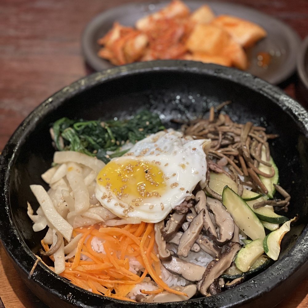 Tosokchon - a bowl of food on a table - Korean Near Me - Annandale, Virginia