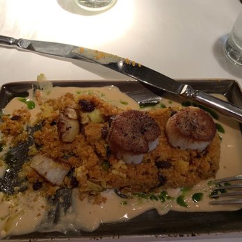 Montrio - Seared scallops with red coconut curry sauce. - New American Near Me - Monterey, California Montrio - Seared scallops with red coconut curry sauce. - New American Near Me - Monterey, California
