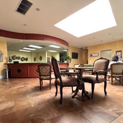 Cinema Orthodontics - Cozy Lobby/Waiting area w/ great natural lighting. Plenty of seats & tables too.
