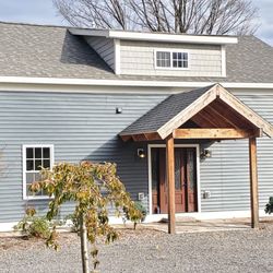 A Best Radon Systems - A Best Radon Systems - Manlius home. The radon fan and vent pipe are at the left rear side of house. The white vent blends with white trim.