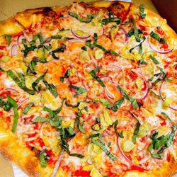 Tomato Pie Pizza Joint - NY style pizza w/ plant based cheese & toppings. Delicious!