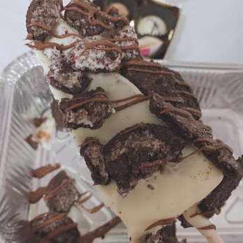 The Nom Nom Stop - Cheesecake on a stick covered in white chocolate and topped with Oreos. - Desserts Near Me - Lacey, Washington The Nom Nom Stop - Cheesecake on a stick covered in white chocolate and topped with Oreos. - Desserts Near Me - Lacey, Washington