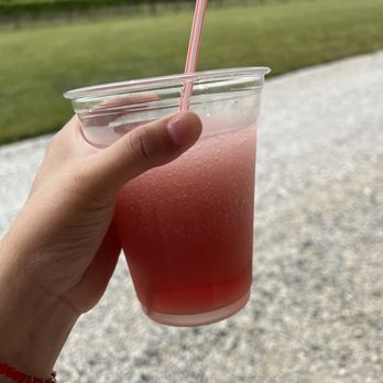 Cauble Creek Vineyard - a hand holding a glass of watermelon - Wineries Near Me - Salisbury, North Carolina