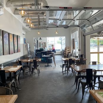 Sidewall Pizza - empty dining area with tables and chairs - Pizza Near Me - Greenville, South Carolina Sidewall Pizza - empty dining area with tables and chairs - Pizza Near Me - Greenville, South Carolina