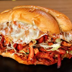 Torta La Cochinada 6 different meats, lettuce, beans, cheese and crema.