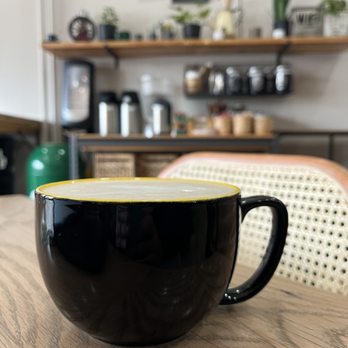 Café Com Leite - a cup of coffee on a table - Cafes Near Me - Phoenixville, Pennsylvania Café Com Leite - a cup of coffee on a table - Cafes Near Me - Phoenixville, Pennsylvania