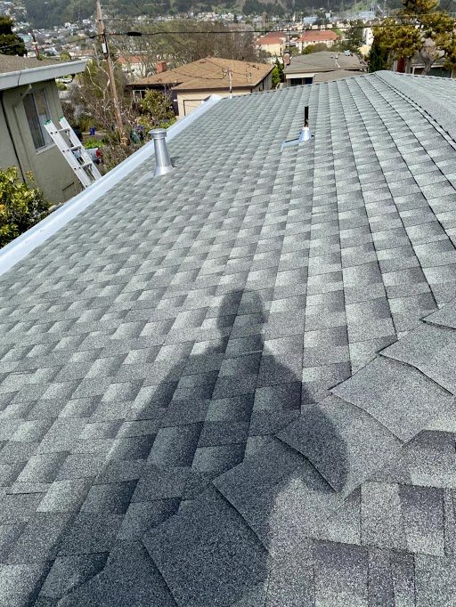 Slide of Mel's Roofing