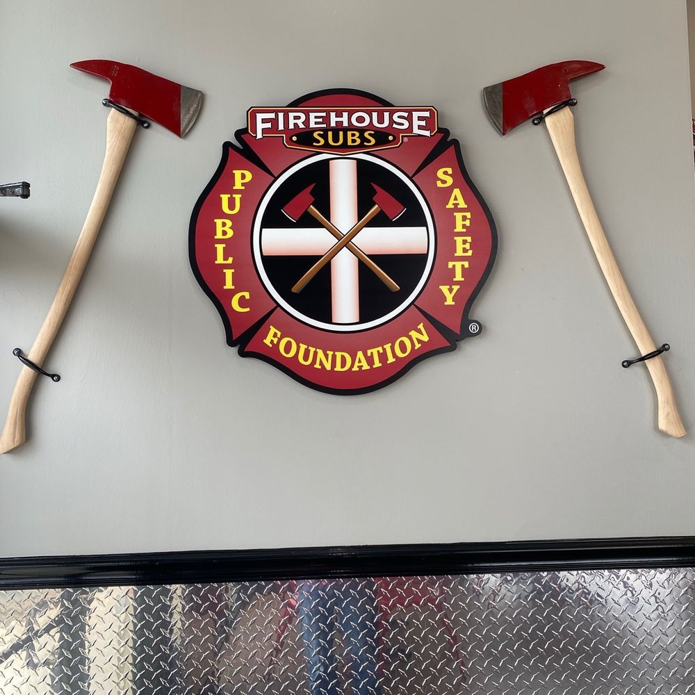 a fireman's badge and axes