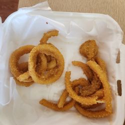 The Drinking Well Tavern & Grill - Pickup order of Onion Rings $8  The picture was taken before any were eaten. Delicious but not crispy enough.