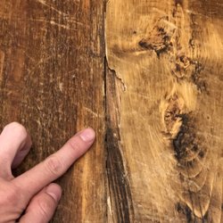 Wild West Furnishings - Water damage from using screws when we have radiant floor heating - now has slow leak under the entire living room and its cracking the wood