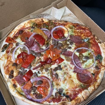 MOD Pizza - Pizza w/ red sauce, pesto, garlic rub, salami, pepperoni, ground beef, spicy chicken sausage, onions, & mama lils sweet peppers - Fast Food Near Me - Snoqualmie, Washington