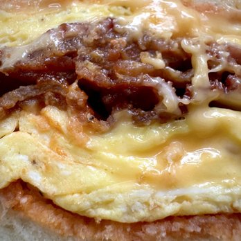 Mr Bacon Egg & Cheese - "Mr. Bacon Egg & Cheese" sandwich -- a bacon, egg, and cheese on a sourdough roll - Breakfast & Brunch Near Me - New York, New York Mr Bacon Egg & Cheese - "Mr. Bacon Egg & Cheese" sandwich -- a bacon, egg, and cheese on a sourdough roll - Breakfast & Brunch Near Me - New York, New York