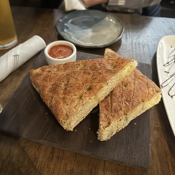 Larch - FOCACCIA warm focaccia bread served with spiced tomato oil - Pasta Shops Near Me - Leavenworth, Washington Larch - FOCACCIA warm focaccia bread served with spiced tomato oil - Pasta Shops Near Me - Leavenworth, Washington