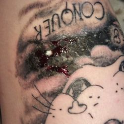Electric Tattoo - Physical damage caused from owner Mike Valdez , this was a few days after the cover up and it was bleeding terribly. I had issues walking.