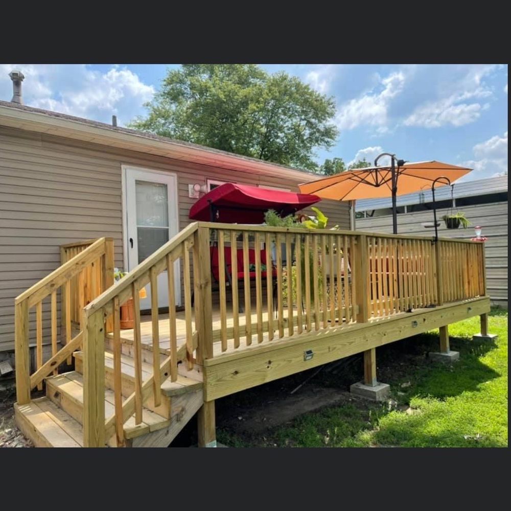 Evolution Contracting - a deck with a red umbrella - General Contractors Near Me - Madison, Illinois Evolution Contracting - a deck with a red umbrella - General Contractors Near Me - Madison, Illinois