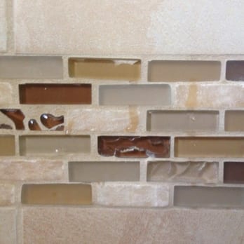 Treeium - San Diego - The grout going completely over the glass tiles. They said it's supposed to be that way....argh - General Contractors Near Me - San Diego, California