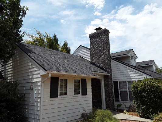 Efrain Zepeda's Rainbow Roofing Logo