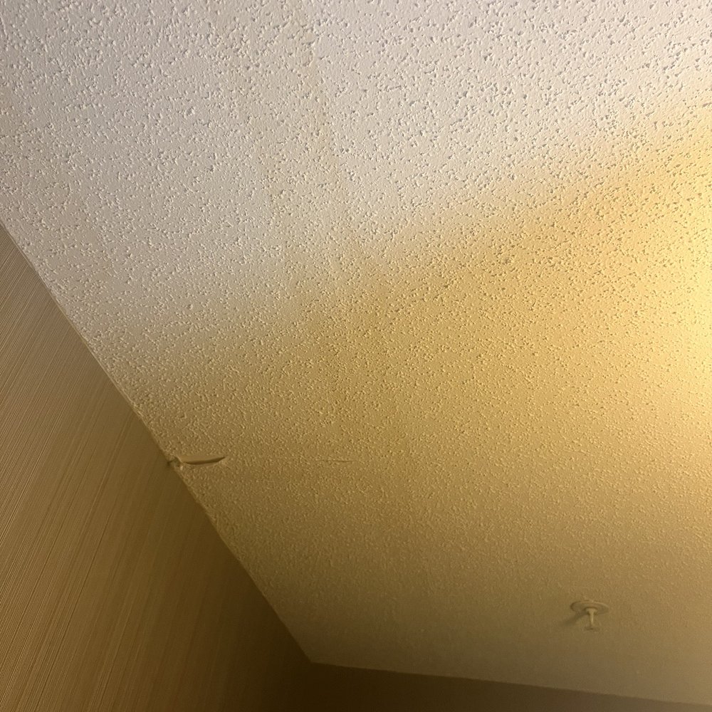 Water damage on ceiling. Water damage on ceiling.