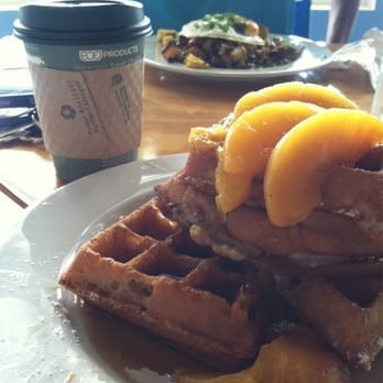 Blue Surf Cafe - Peaches and coconut cream waffles and potato hash with eggs in the background. Yuuuum!! - Cafes Near Me - Wilmington, North Carolina