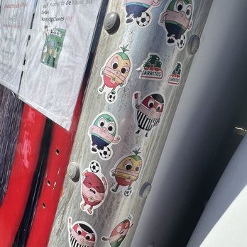 Tacos El Vale - stickers on a metal pole - Food Trucks Near Me Tacos El Vale - stickers on a metal pole - Food Trucks Near Me