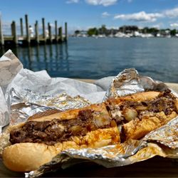Pip's Dock Street Dogs - Buy a cheesesteak at Pip's, watch for boats.