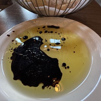 Aroojis Wine Room - Olive oil in balsamic vinegar for fresh bread - Italian Near Me - Charlotte, North Carolina
