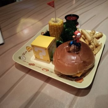 Toadstool Cafe - Cheeseburger with fries broccoli and a chocolate dessert coin - Burgers Near Me - Orlando, Florida Toadstool Cafe - Cheeseburger with fries broccoli and a chocolate dessert coin - Burgers Near Me - Orlando, Florida