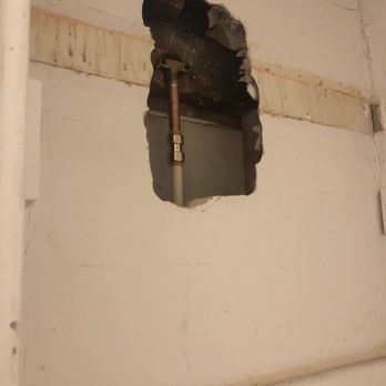Whitney Services - Hole punched with a hammer - Electricians Near Me - Kalamazoo, Michigan