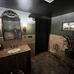 New Taj India - Women's Bathroom- Seat and Table, Full Sized Leaning Mirror, Beautiful Sink, Vanity Mirror, Sconces. Clean and well kept.