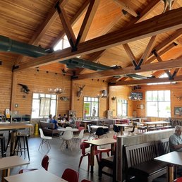 inside of a restaurant with tables and chairs