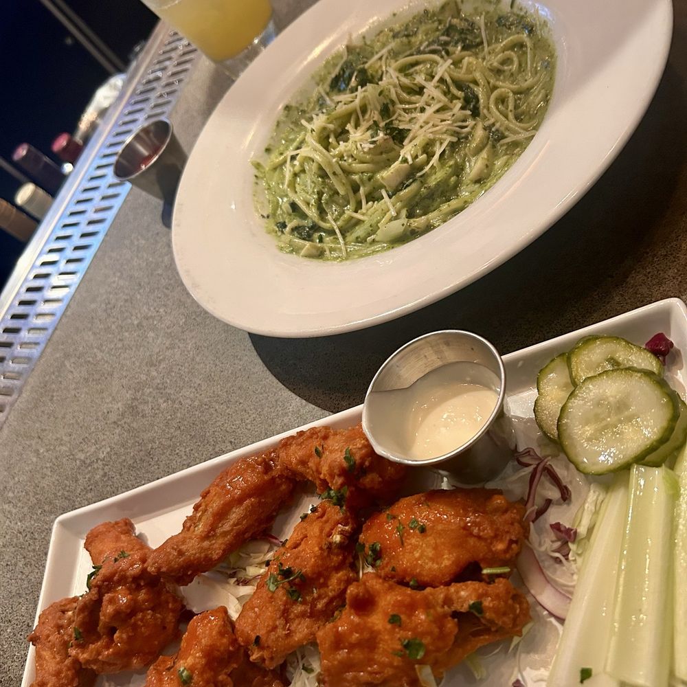 Buffalo chicken wings and pesto pasta