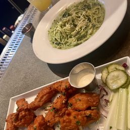 Buffalo chicken wings and pesto pasta