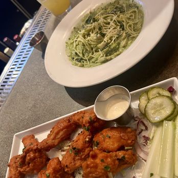 Ka Lihikai - Buffalo chicken wings and pesto pasta - Cocktail Bars Near Me - Hilo, Hawaii