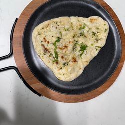 Naan infused with fresh garlic and herbs.