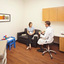 MedSpring Urgent Care - Exam rooms with flat screen TV, couch and Wi-Fi