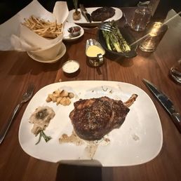 Pork chop entrée, half and half fries, asparagus, New York strip steak entrée Pork chop entrée, half and half fries, asparagus, New York strip steak entrée