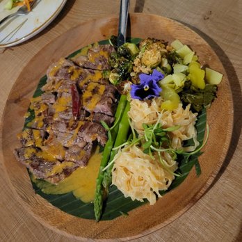 Attraros Thai Eatery - Nuer yang - grilled ribeye steak w curry sauce, egg noodles and fried Brussels sprouts. Wasn't sure what to expect but it was good! - Thai Near Me - Oakland, California