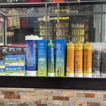 Flavors - a variety of products displayed in a store window - Convenience Stores Near Me - Emeryville, California