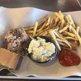 Pulled pork with house made fries, house made cole slaw and corn bred