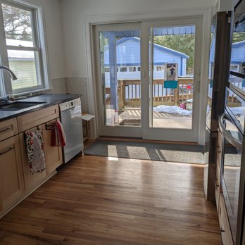 Skylands Services - a kitchen with a sliding glass door - General Contractors Near Me - Delmar, New York