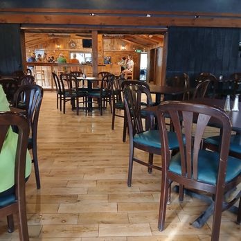 T's Hitching Post - From main dining area toward the bar. - American Near Me - Port Crane, New York T's Hitching Post - From main dining area toward the bar. - American Near Me - Port Crane, New York