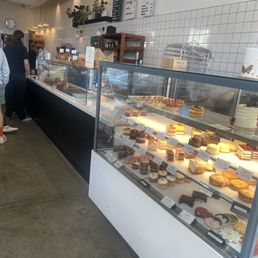 Line passes breads, pastry, cake displays