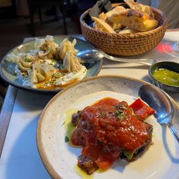 Turkmen manti dumplings, eggplant kopoglu, bread.