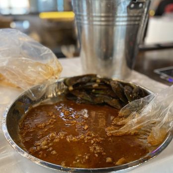 Cajun Crack'n - House Special Sauce (mix of New Orleans Cajun, Garlic Butter, Lemon Pepper sauces) leftover from boil. Took home to sauté noodles in later - Seafood Near Me - Milpitas, California