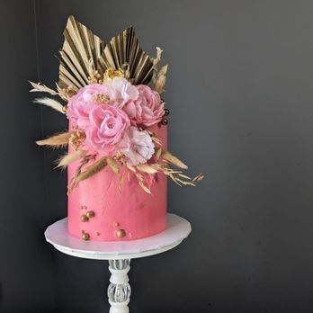 Shalom Bakery - a pink cake with gold accents - Custom Cakes Near Me