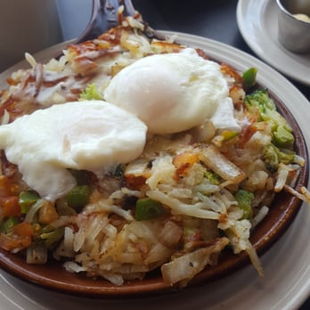 Stacked - Veggie skillet with poached eggs.... - Breakfast & Brunch Near Me - Oak Lawn, Illinois
