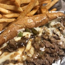 Game Time Sports Bar & Grill - Mouth watering Philly Cheesesteak with thinly sliced real ribeye!
